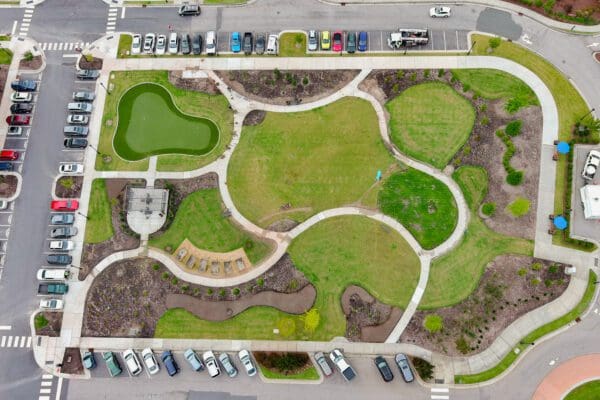 An aerial shot looking down on a green space at a living facility.