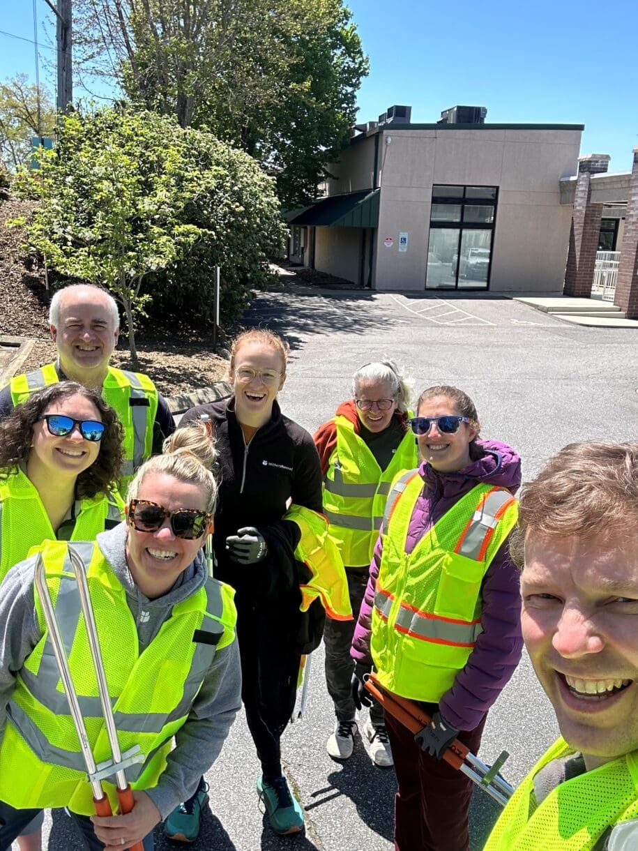 A group of Asheville employees wearing safety gear