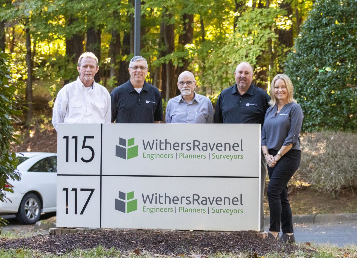 WithersRavenel leaders pose with staff of Koonce, Noble & Associates