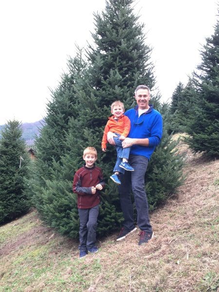 a family at a Christmas Tree farm