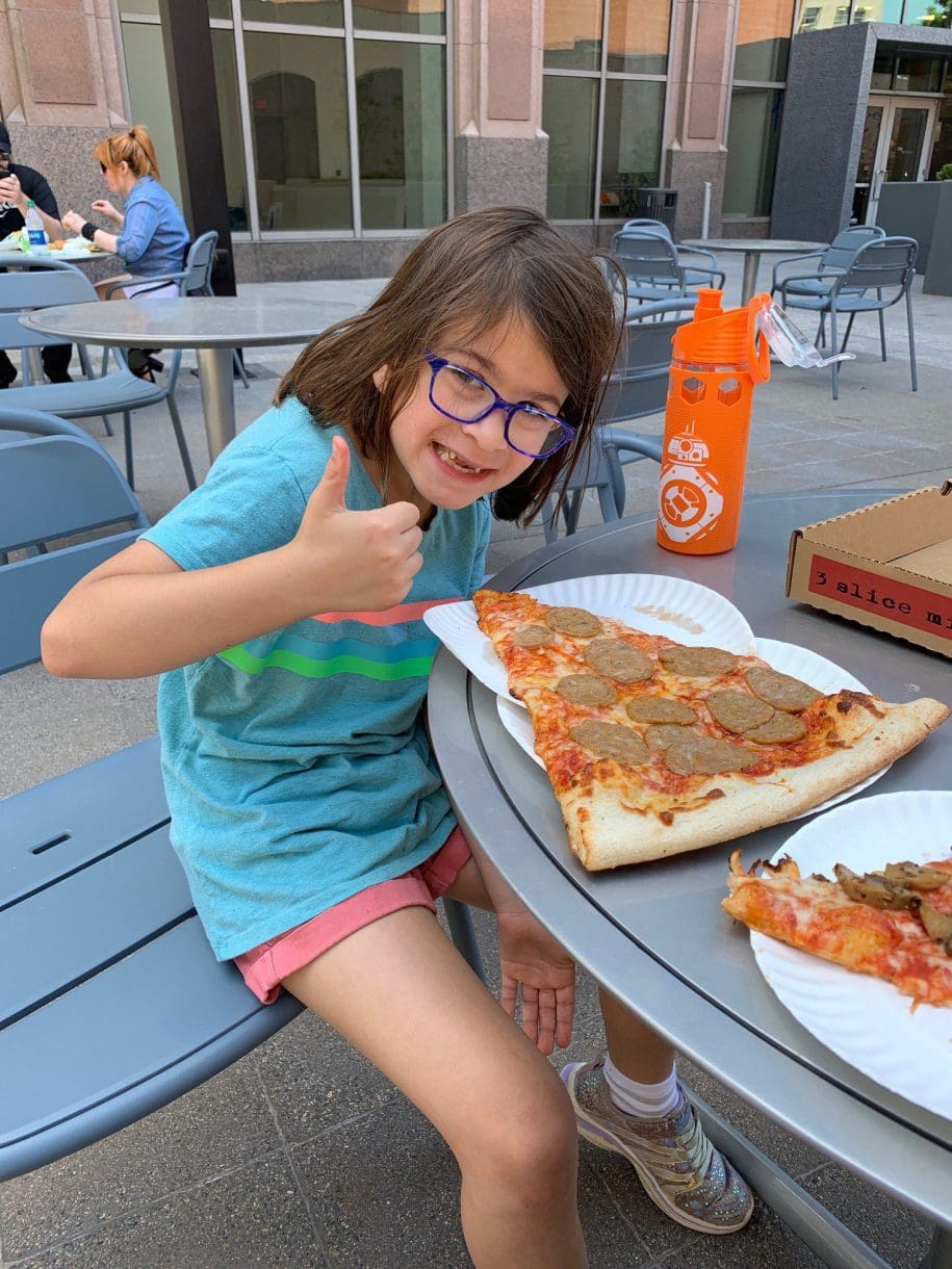 a child eating pizza