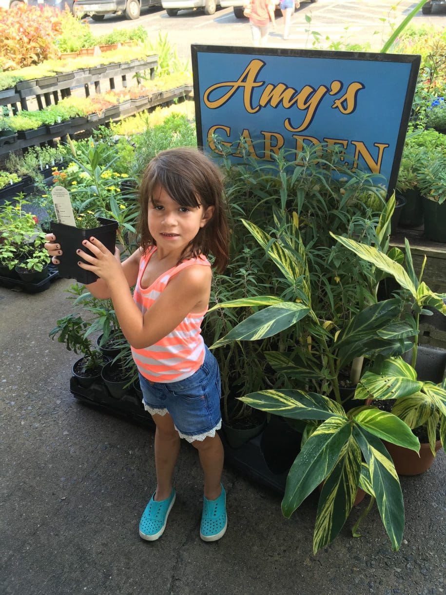 a child at Amy's Garden