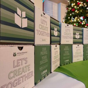 A marketing display made of stacked boxes that say "Let's Create Together"