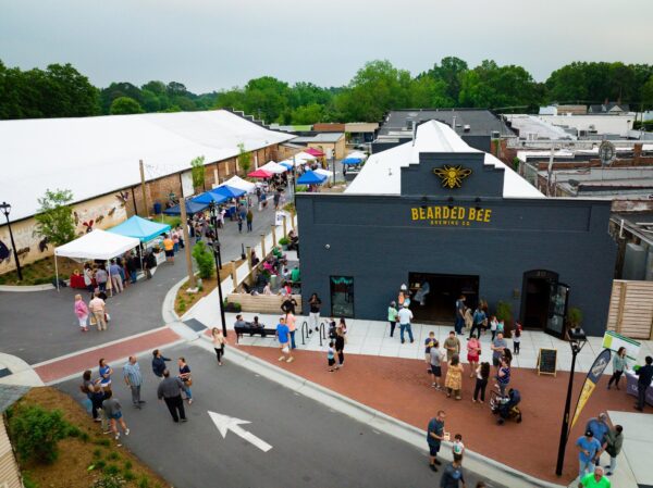 Brewery and streetscape with an outdoor festival and gathering space
