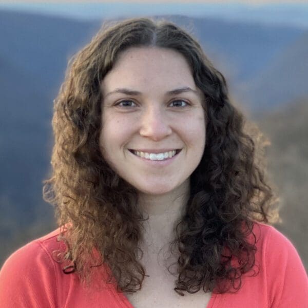 Young woman with long curly brown hair