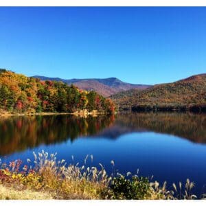 A picture looking across a lake with a new dam.