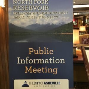 A banner for a new dam project at a public information meeting.