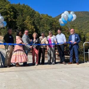 A ribbon-cutting ceremony at the opening of a new dam.