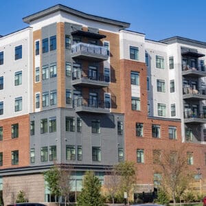 Photos from a sidewalk looking up at residential buildings in Cary, North Carolina.