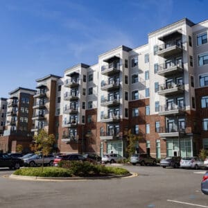 Photos from a sidewalk looking up at residential buildings in Cary, North Carolina.