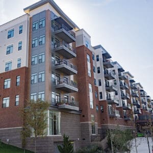 Photos from a sidewalk looking up at residential buildings in Cary, North Carolina.