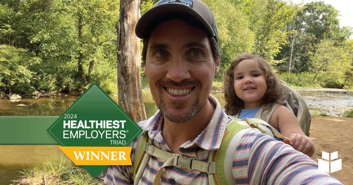 WithersRavenel employee hiking with child.