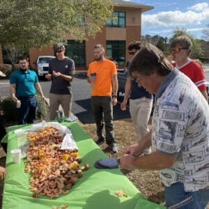 Wilmington staff ready to eat low country boil on a table.