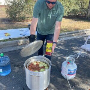 Low country boil being prepared in a pot.