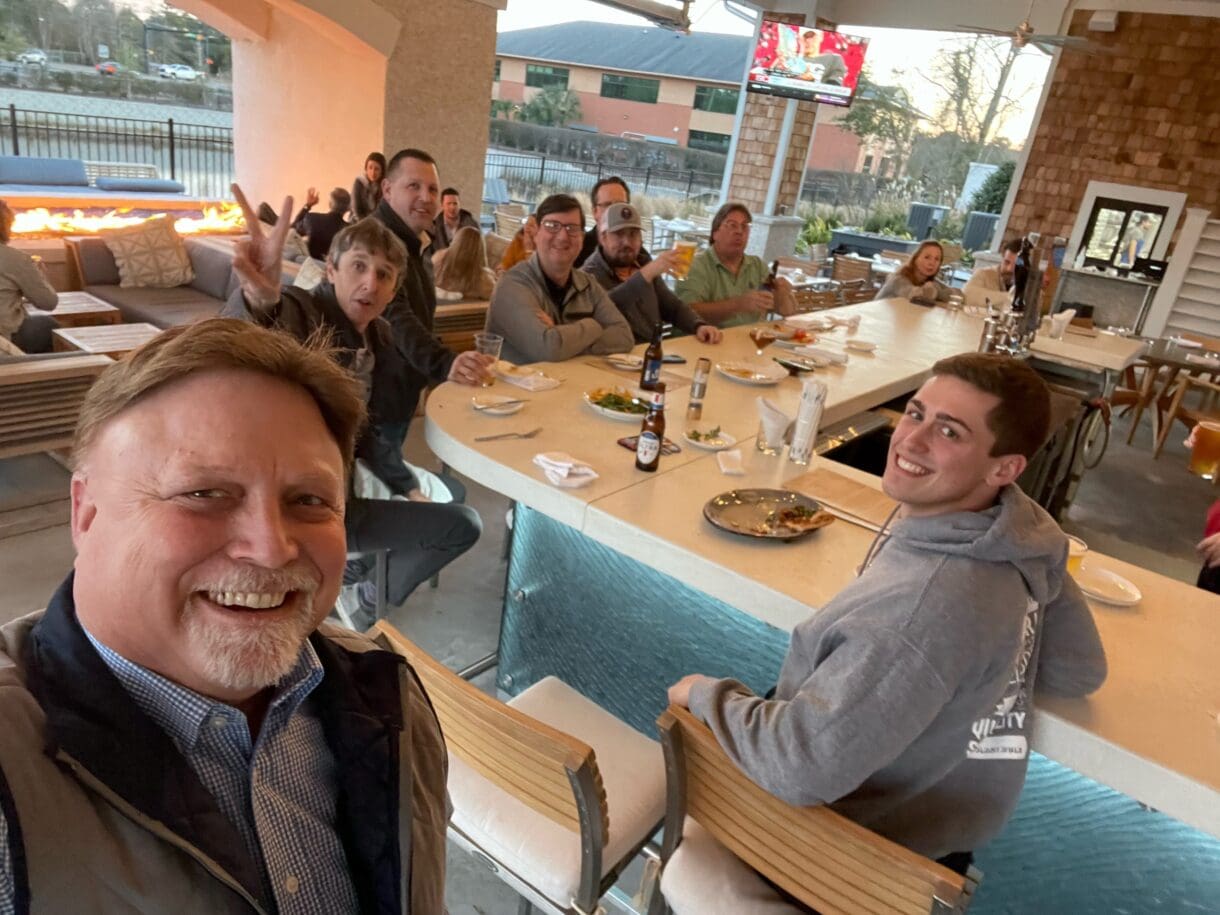 Wilmington staff members at a restaurant celebrating.