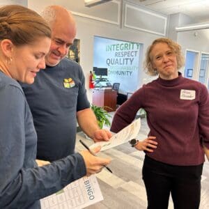 Asheville office employees talking and volunteering