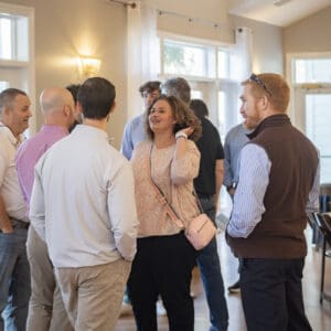 Company members mingle at professional recognition event