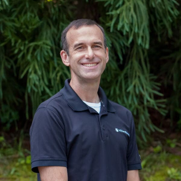 A headshot image of a WithersRavenel employee in front of trees.