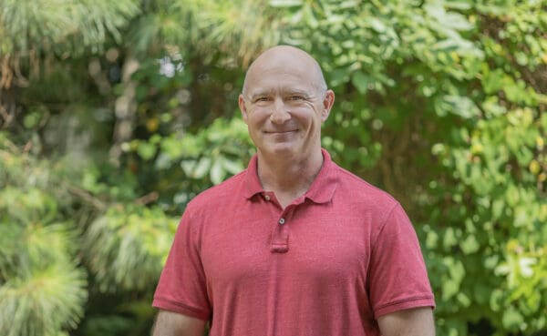 A headshot of a WithersRavenel employee standing in front of trees.
