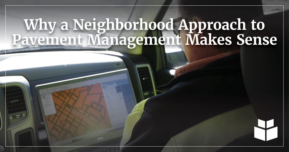 An image overlooking the shoulder of a pavement management professional who is looking at their laptop.