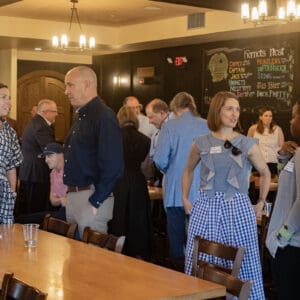 Attendees of a conference event mingling.