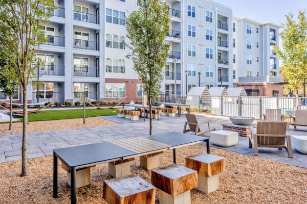 A completed outdoor dining area surrounded by residential buildings. 