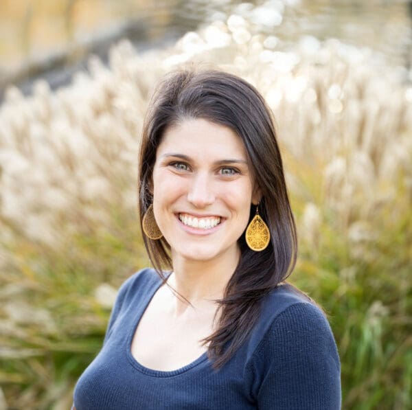 A headshot of a WithersRavenel employee standing in front of a field.