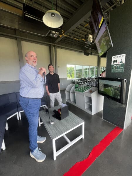 Two WithersRavenel colleagues at a team bonding event at Drive Shack in Raleigh.