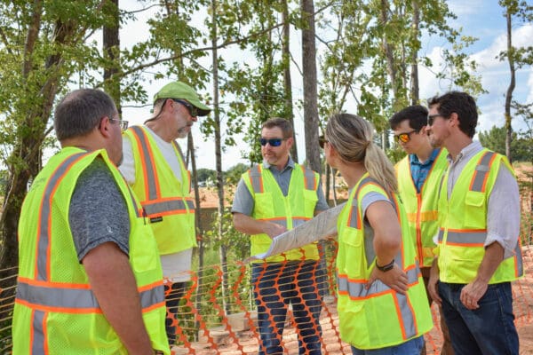 WithersRavenel Design + Planning team members in discussion while visiting a project site.