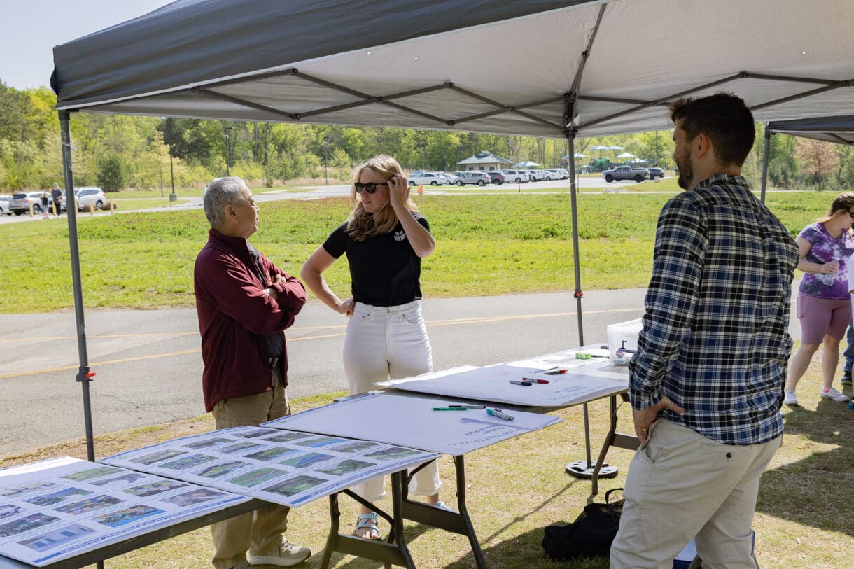 Members of the WithersRavenel Design + Planning meeting with community residents to discuss park updates.