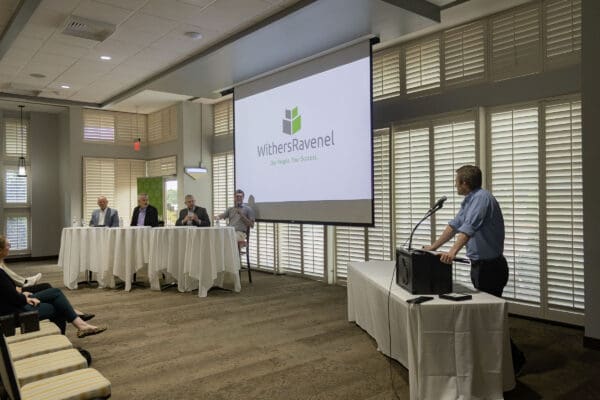 Panelists and a moderator speaking at LandCon.