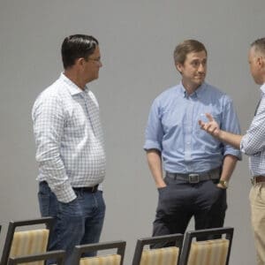 LandCon attendees conversing.