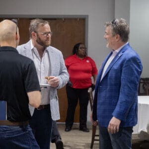 LandCon attendees conversing.