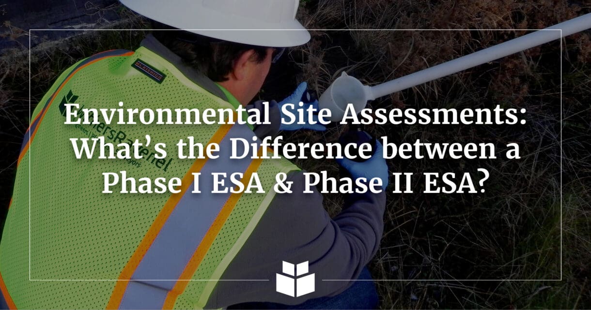 An environmental professional in a safety vest and hard hat in the field collecting an environmental sample
