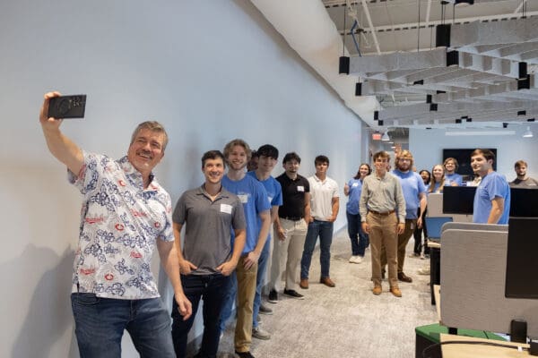 A group of engineers take a selfie