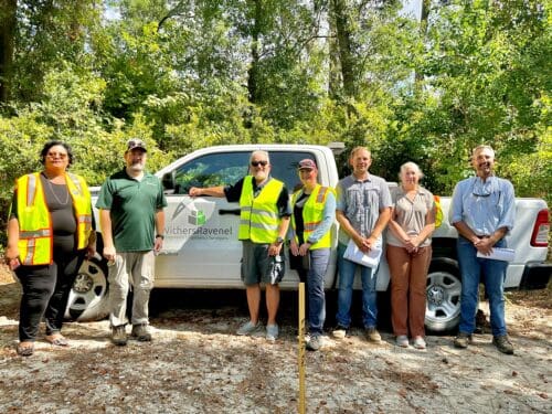 A group of WithersRavenel employee-owners providing civil engineering services with a client at a project site.