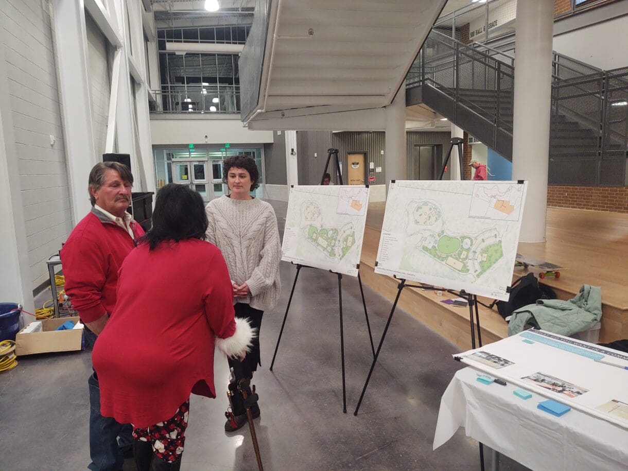 An image of people gathered, soliciting public opinion of the City of Trinity's Park.