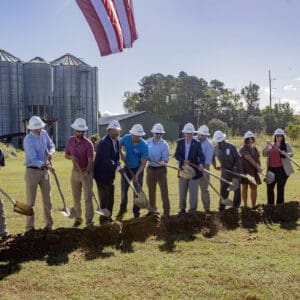 People digging into the ground for the groundbreaking at Madison Street Park in Whiteville.