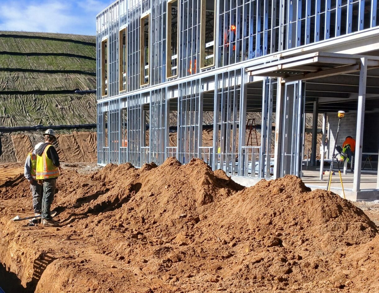 A construction worker oversees installation of underground utilities at the new healthcare facility in Spruce Pine, NC.