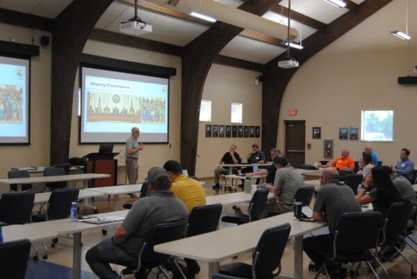 Eddie Staley speaking at PaveCon to a room full of people.