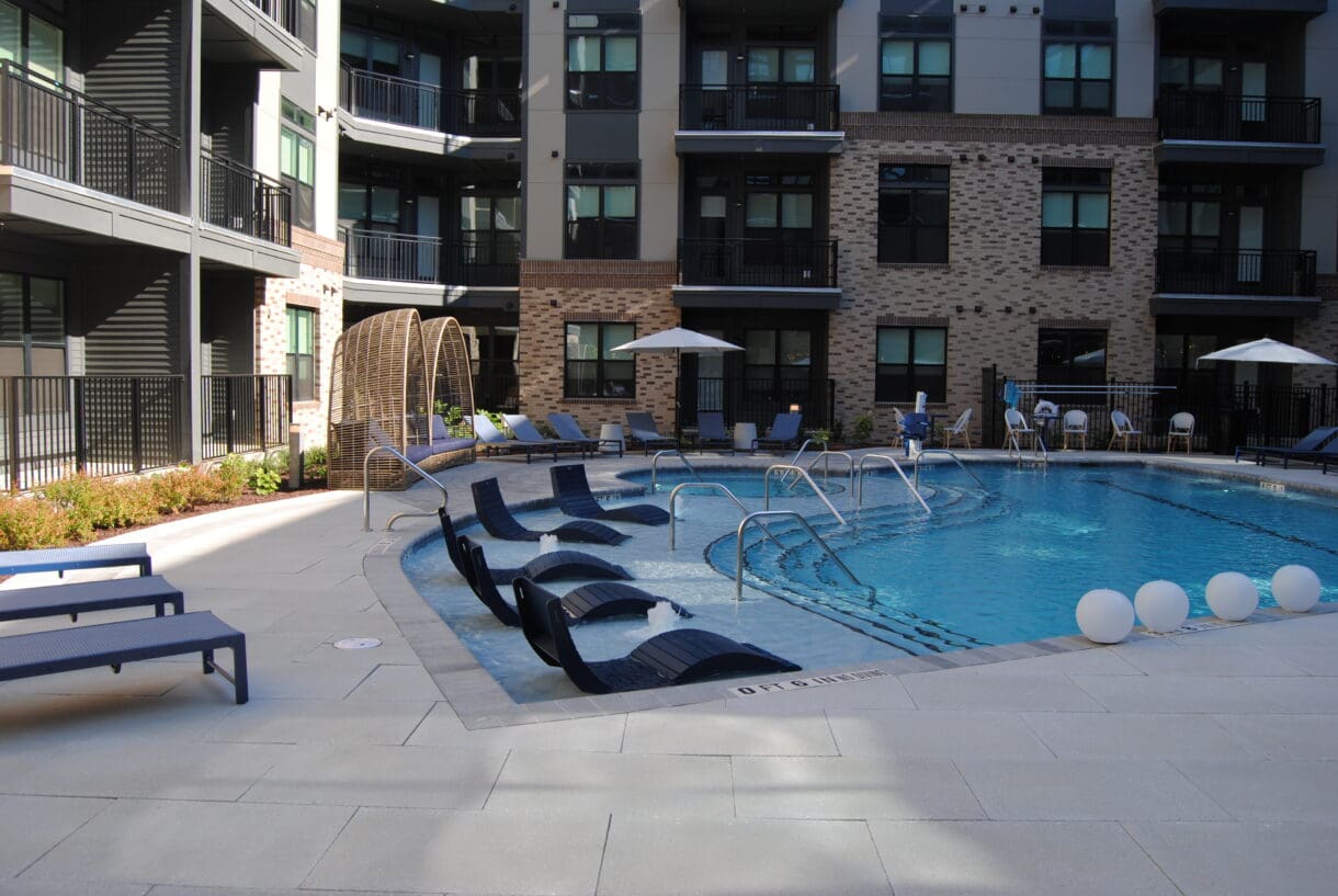 Outdoor pool and lounge area at The Meridian Cary apartments in Downtown Cary.