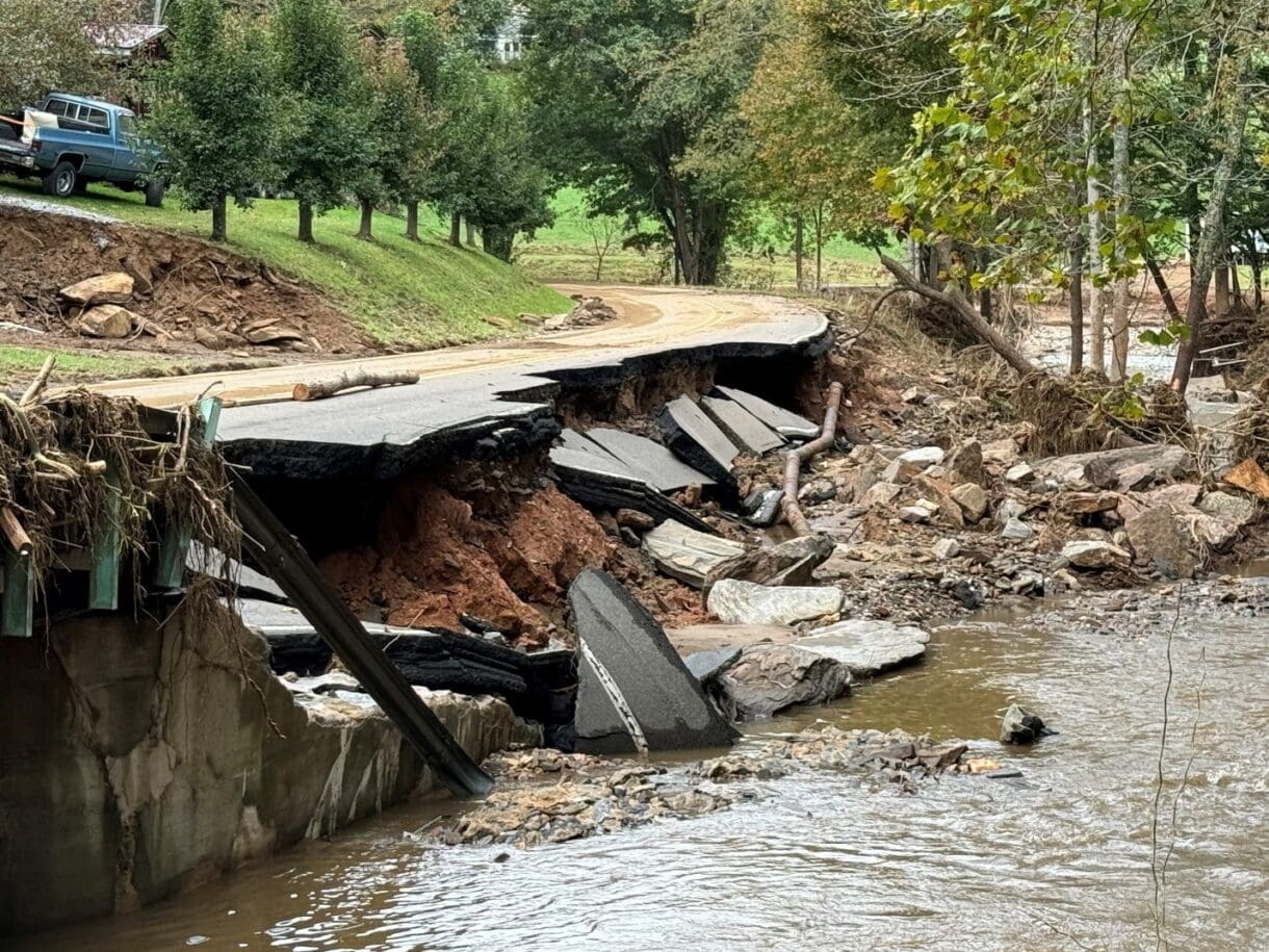 A crumbled road eroded from flooding.