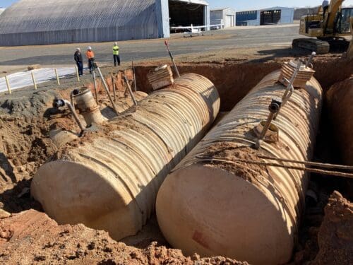 Underground storage tanks being removed from the ground.