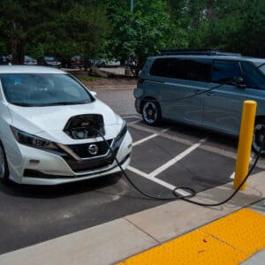 An electric vehicle plugged into a charging unit.