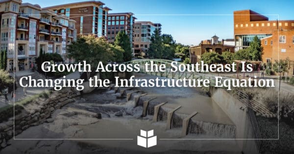 An image of downtown Greenville, South Carolina, with sidewalks and waterway.