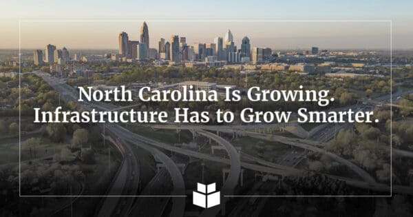An aerial image of Charlotte, NC, with roadways and commuters leaving the city,