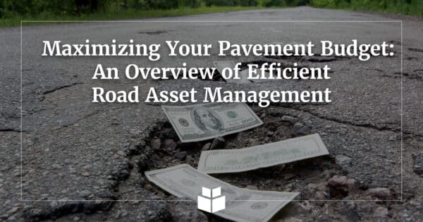 Dollar bills fall into the cracks in asphalt pavement because roadway repairs are needed.