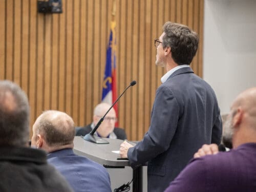 A man speaking at council,