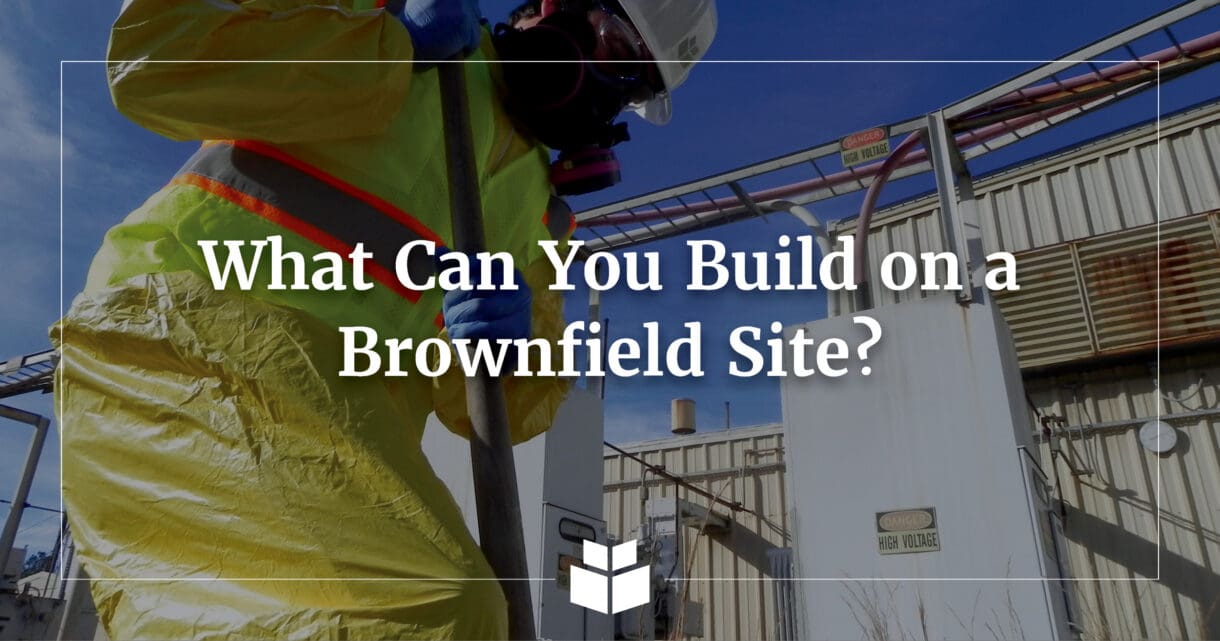 A worker in PPE taking a sample at a Brownfields site