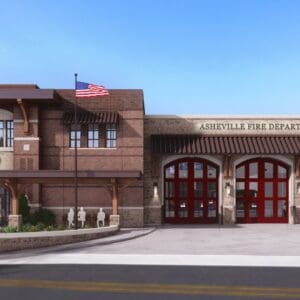 Front elevation rendering of Asheville Oakley Fire Station No. 9 showing three red apparatus bay doors, a covered entrance, and a flagpole.